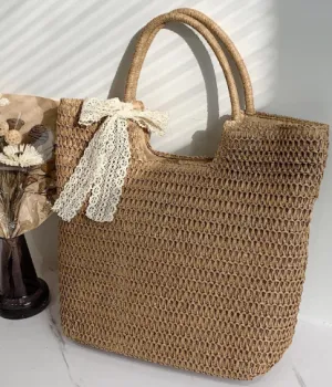 1129 Straw bag decorated with a butterfly knot